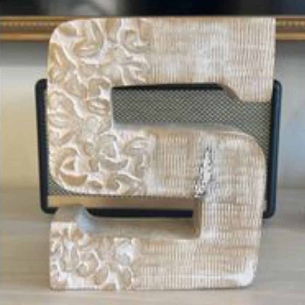 Hand carved letter “S”